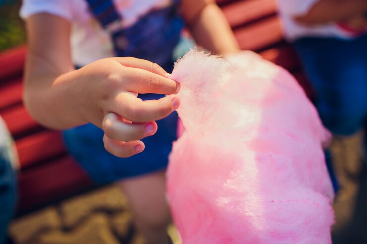 A human hand touching cotton candy recipes