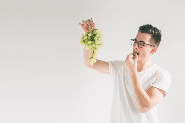 A boy tasting cotton candy grapes and knowing what does cotton candy grapes taste like