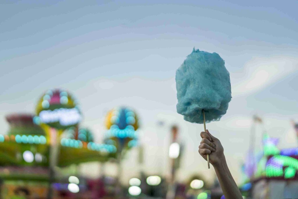 why is cotton candy so expensive. Cotton candy in human hand and explaining