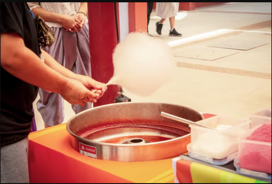 A man preparing candy floss recipes